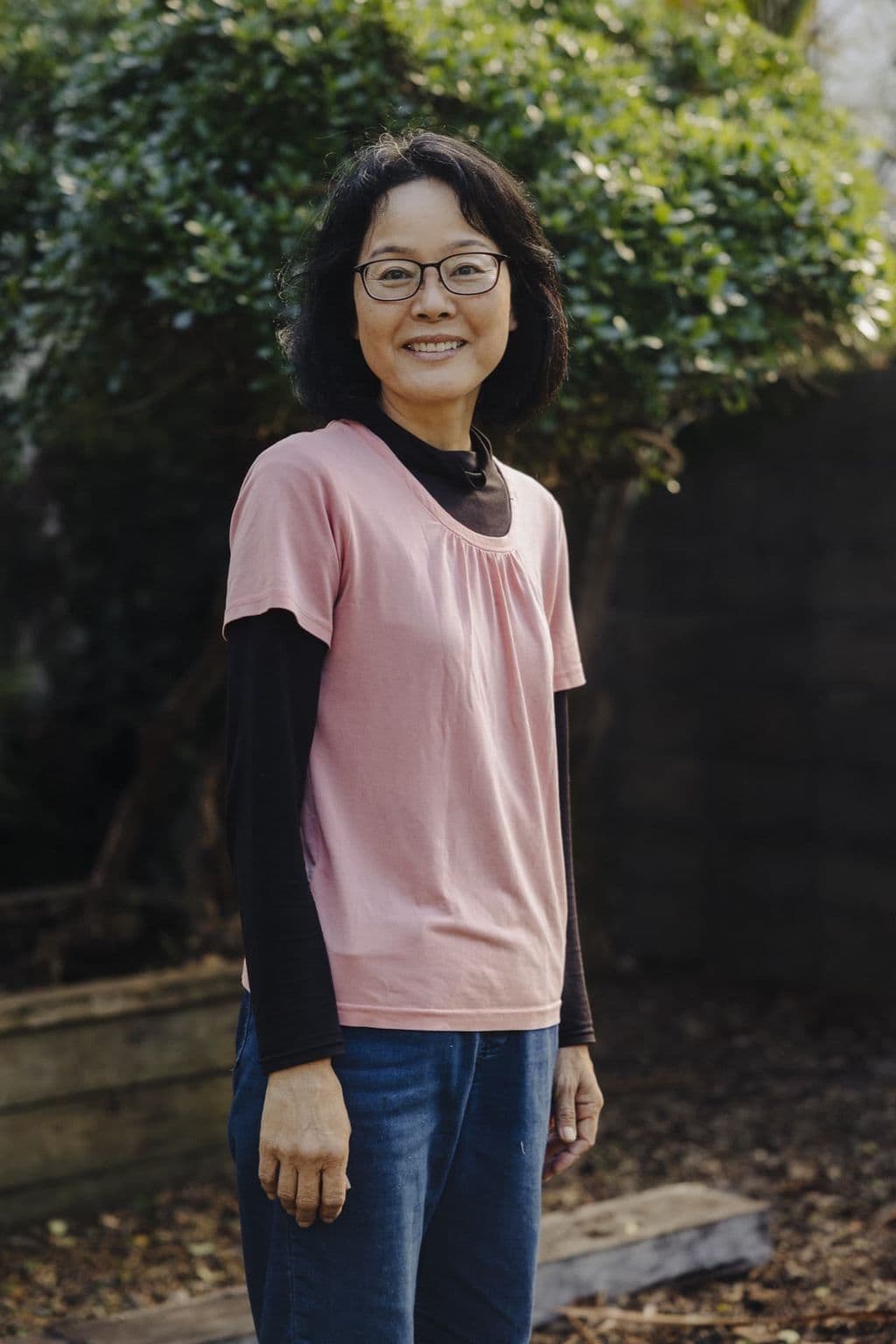 Triton Montessori team member in a pink top photographed outdoors