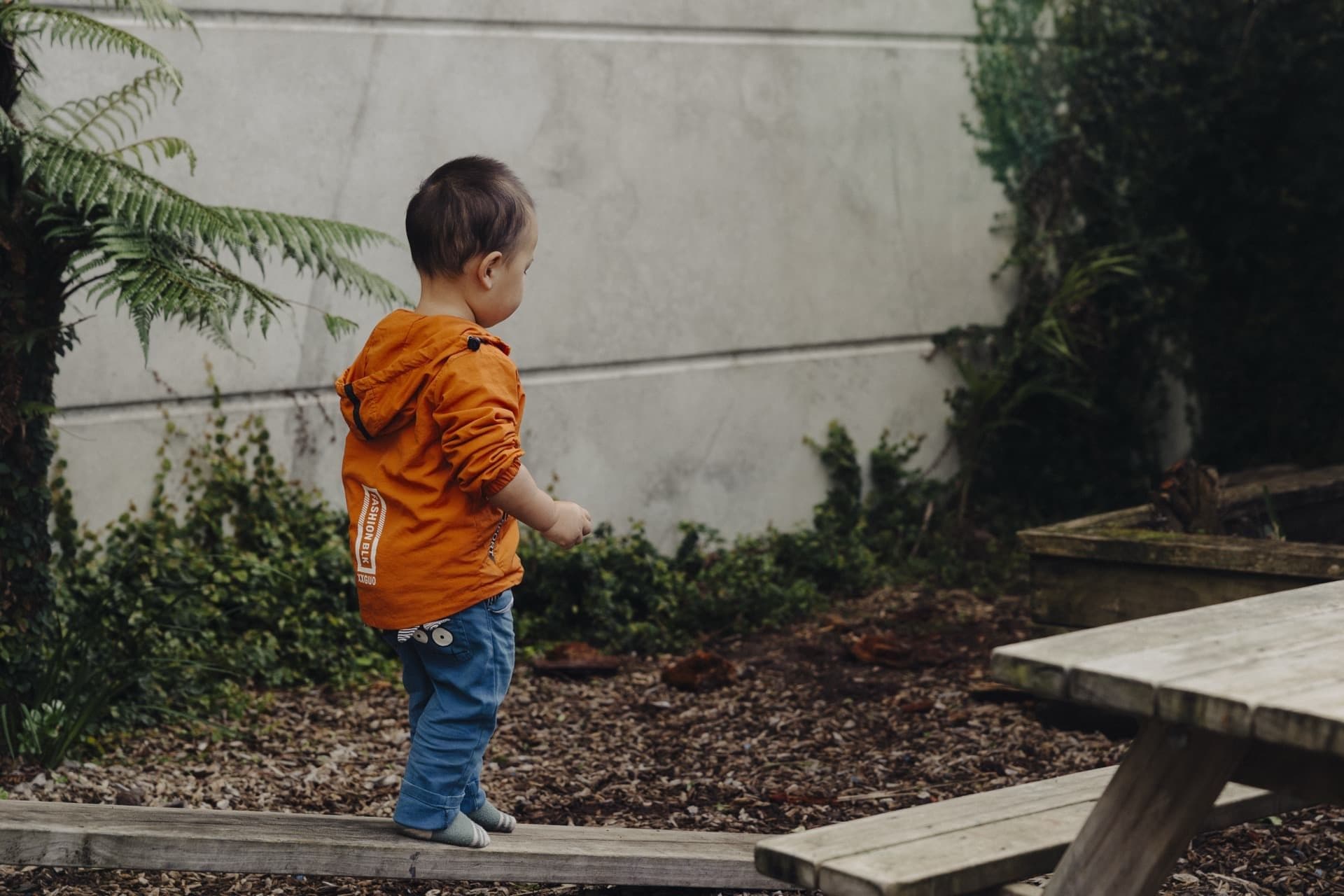 Child walking through the garden area at Triton Montessori Educare