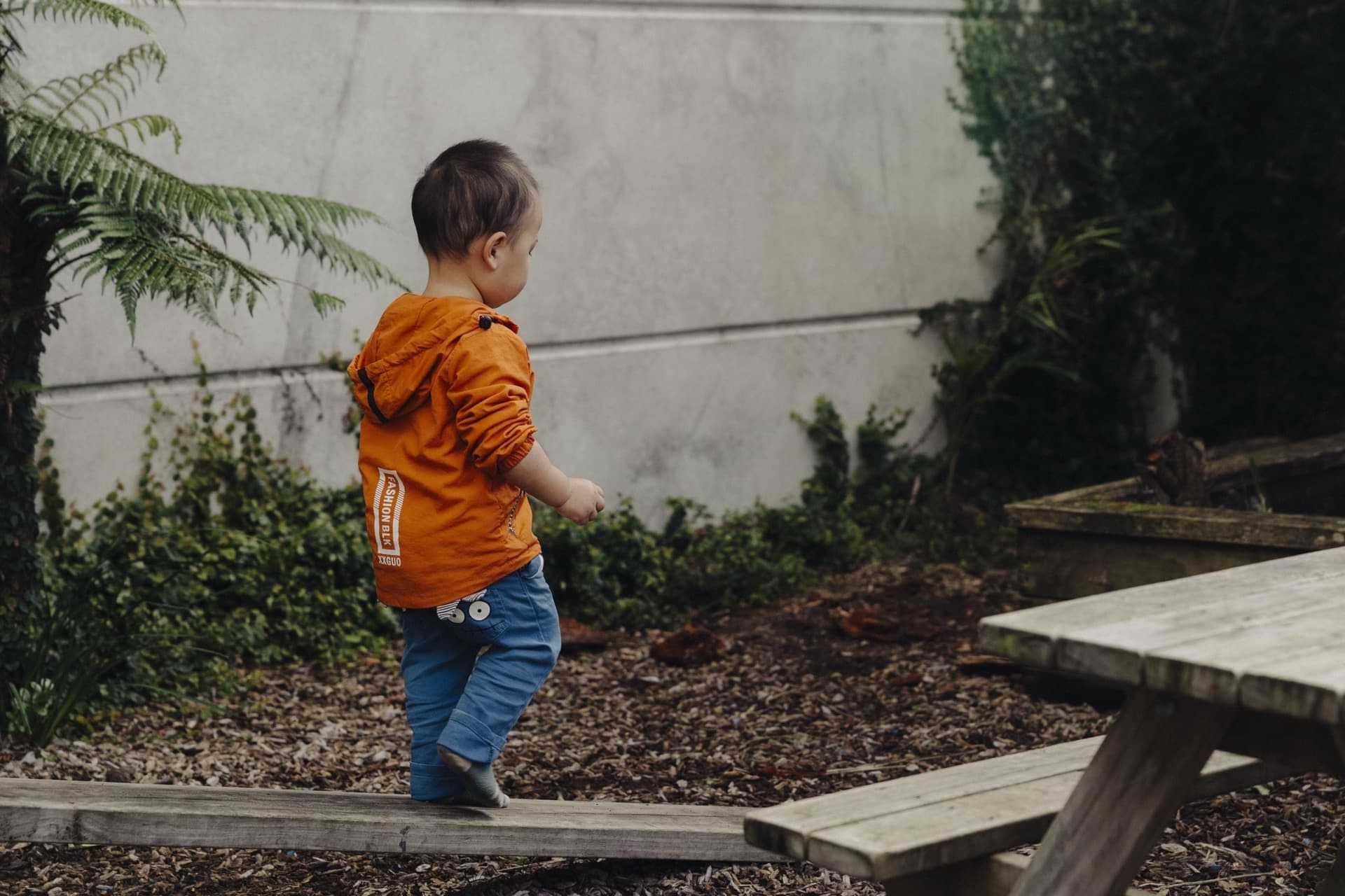 Child walking through the garden area at Triton Montessori Educare